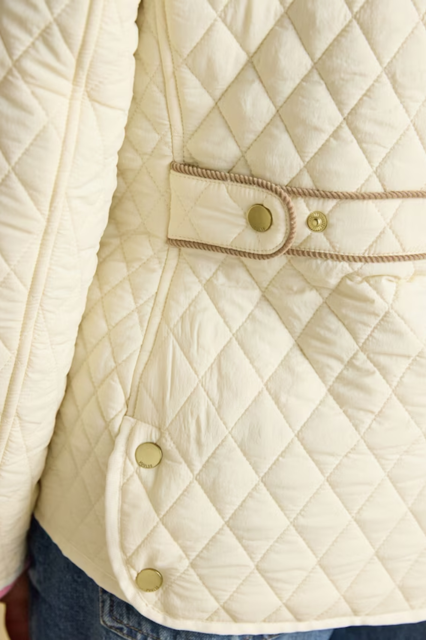 Shop the Joules Highclere showerproof diamond quilted jacket — a stylish and practical layer with cord collar, welt pockets and adjustable waist, perfect for rainy days. Shop Joules at Dotique.