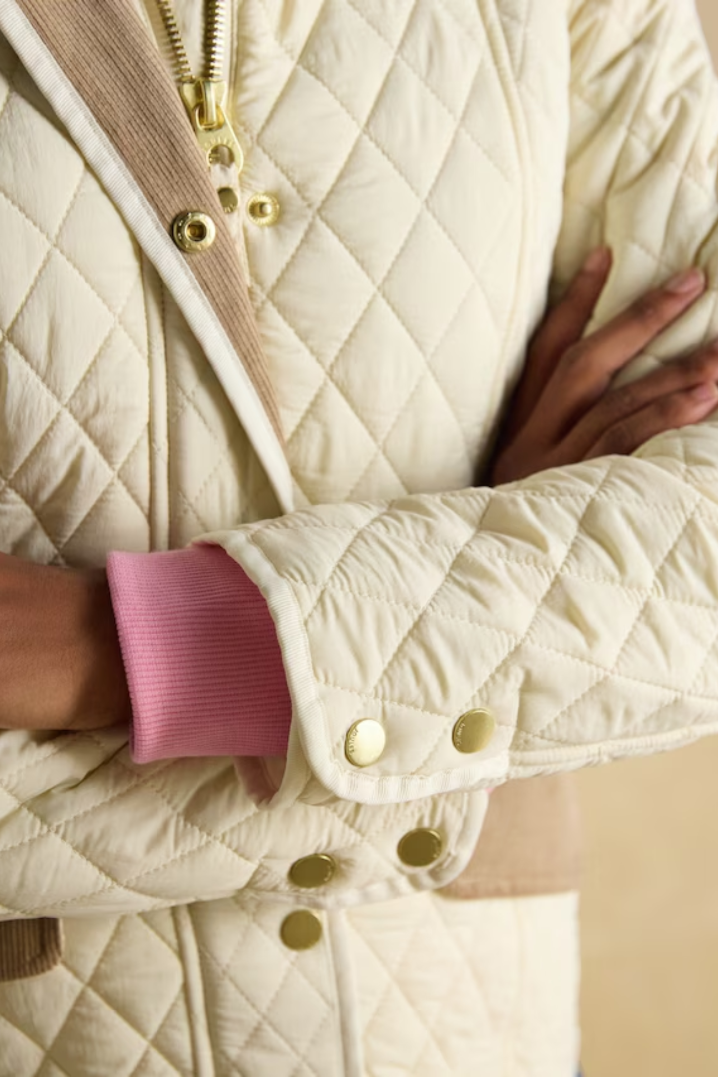 Shop the Joules Highclere showerproof diamond quilted jacket — a stylish and practical layer with cord collar, welt pockets and adjustable waist, perfect for rainy days. Shop Joules at Dotique.