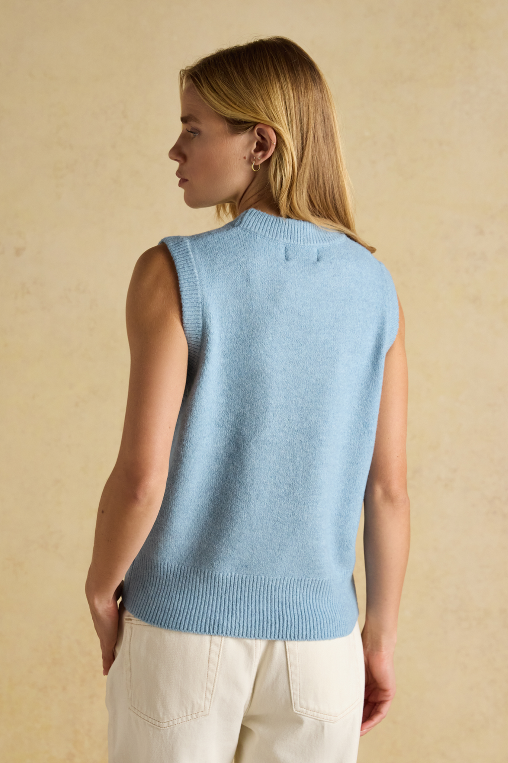 Soft knitted vest by Joules in blue. Easy to layer over shirts or dresses for everyday warmth with a timeless, wearable feel. Shop Joules at Dotique.