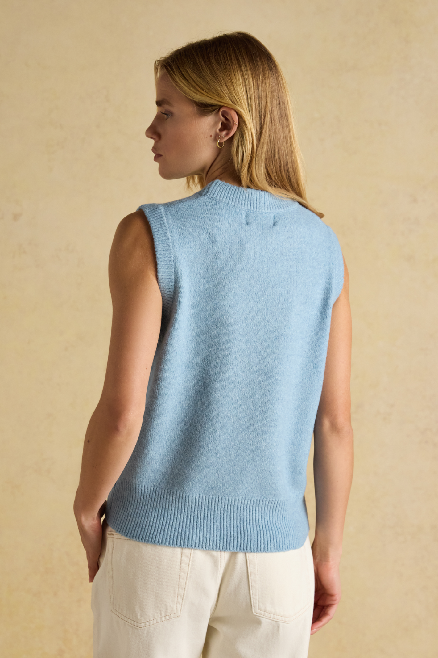 Soft knitted vest by Joules in blue. Easy to layer over shirts or dresses for everyday warmth with a timeless, wearable feel. Shop Joules at Dotique.