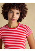 Model wearing Joules H18088 Sophie Ribbed T-Shirt – Pink / Red Stripe, shop Joules at Dotique for stylish looks.