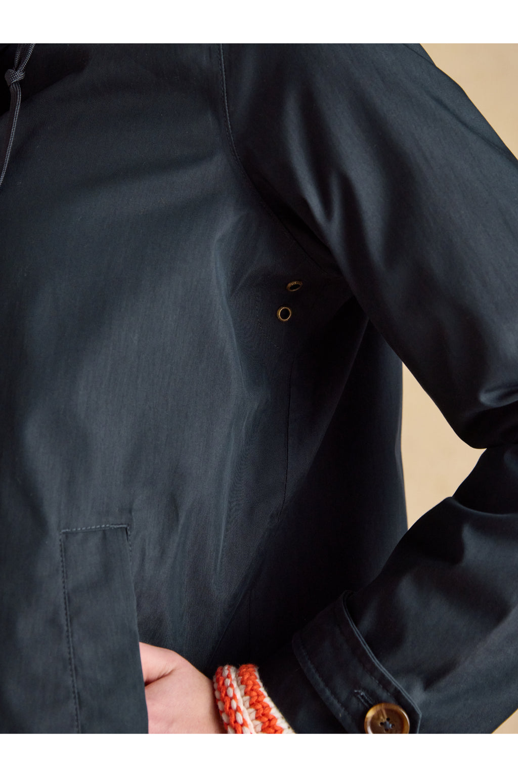 Close-up of sleeve and side pocket detail on Joules H23721 Rainmore Waterproof Coat – Navy by Joules, shop at Dotique.