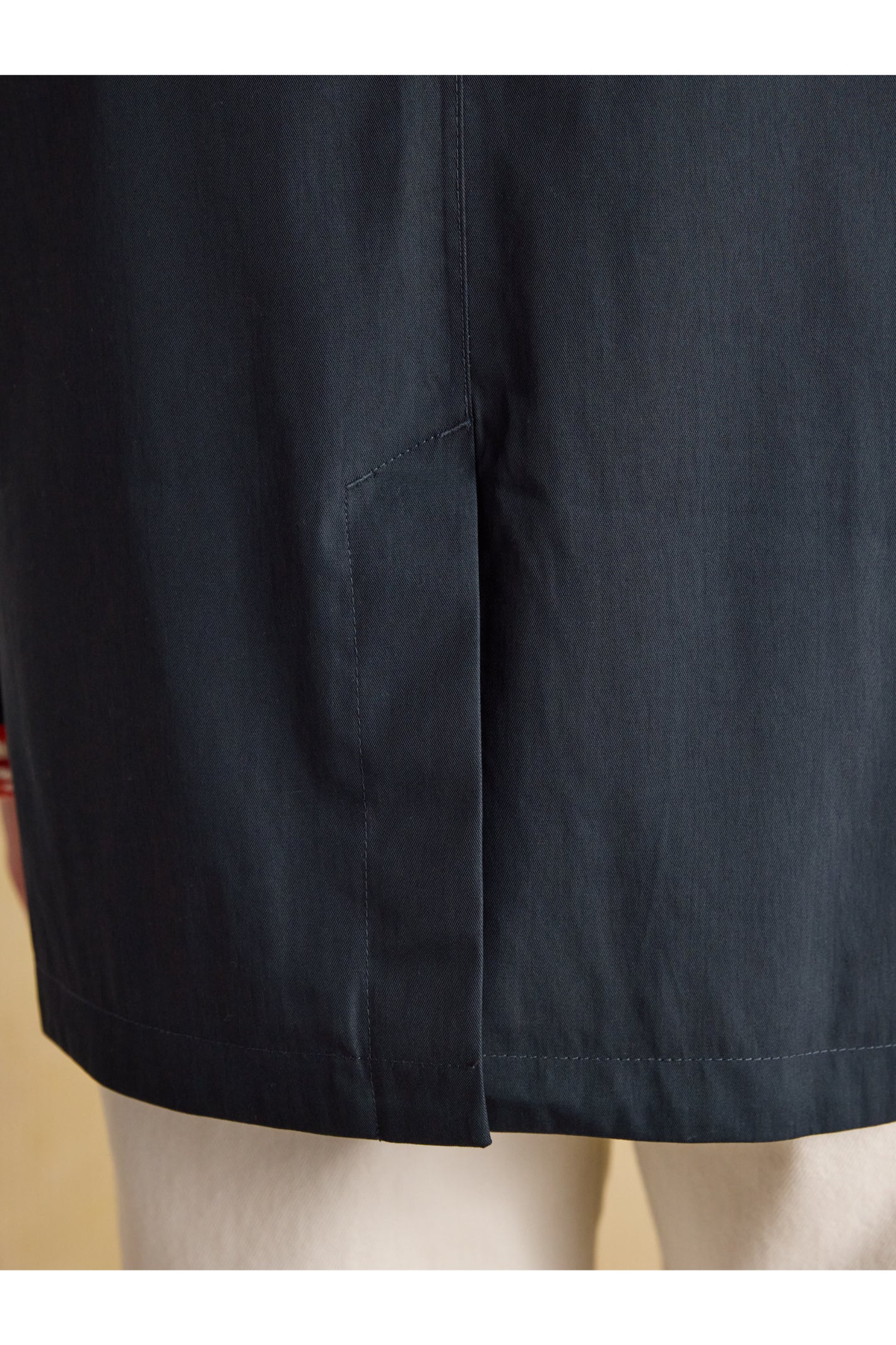 Close-up of navy fabric detailing on Joules H23721 Rainmore Waterproof Coat – Navy, shop Joules at Dotique.