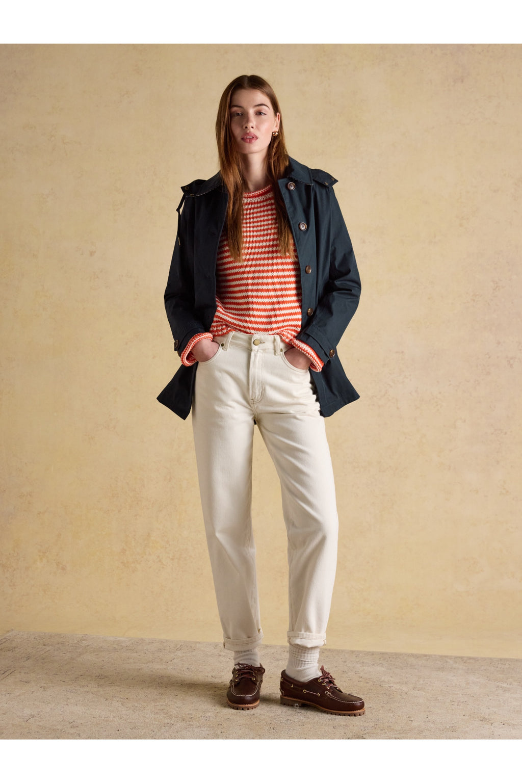 Woman wearing Joules H23721 Rainmore Waterproof Coat – Navy by Joules, shop the Joules collection at Dotique.