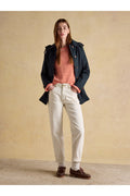 Woman wearing Joules H23721 Rainmore Waterproof Coat – Navy by Joules, shop the Joules collection at Dotique.
