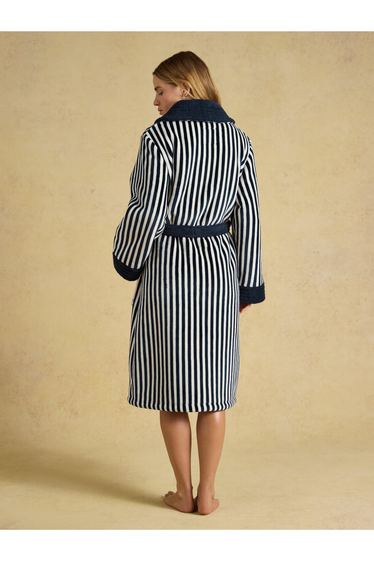 Joules Matilda Navy/Cream Stripe Robe shown on a model from behind. Shop Joules at Dotique