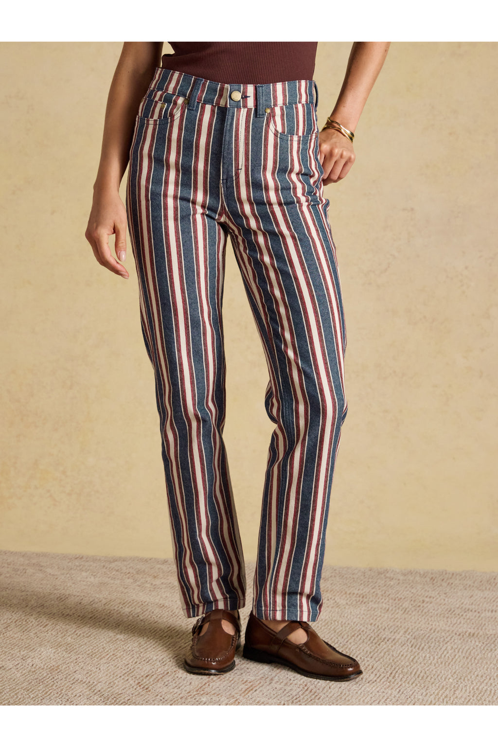 Joules Navy Verigated Stripe Slim Straight Mid Rise Jeans worn by a model. Shop Joules at Dotique