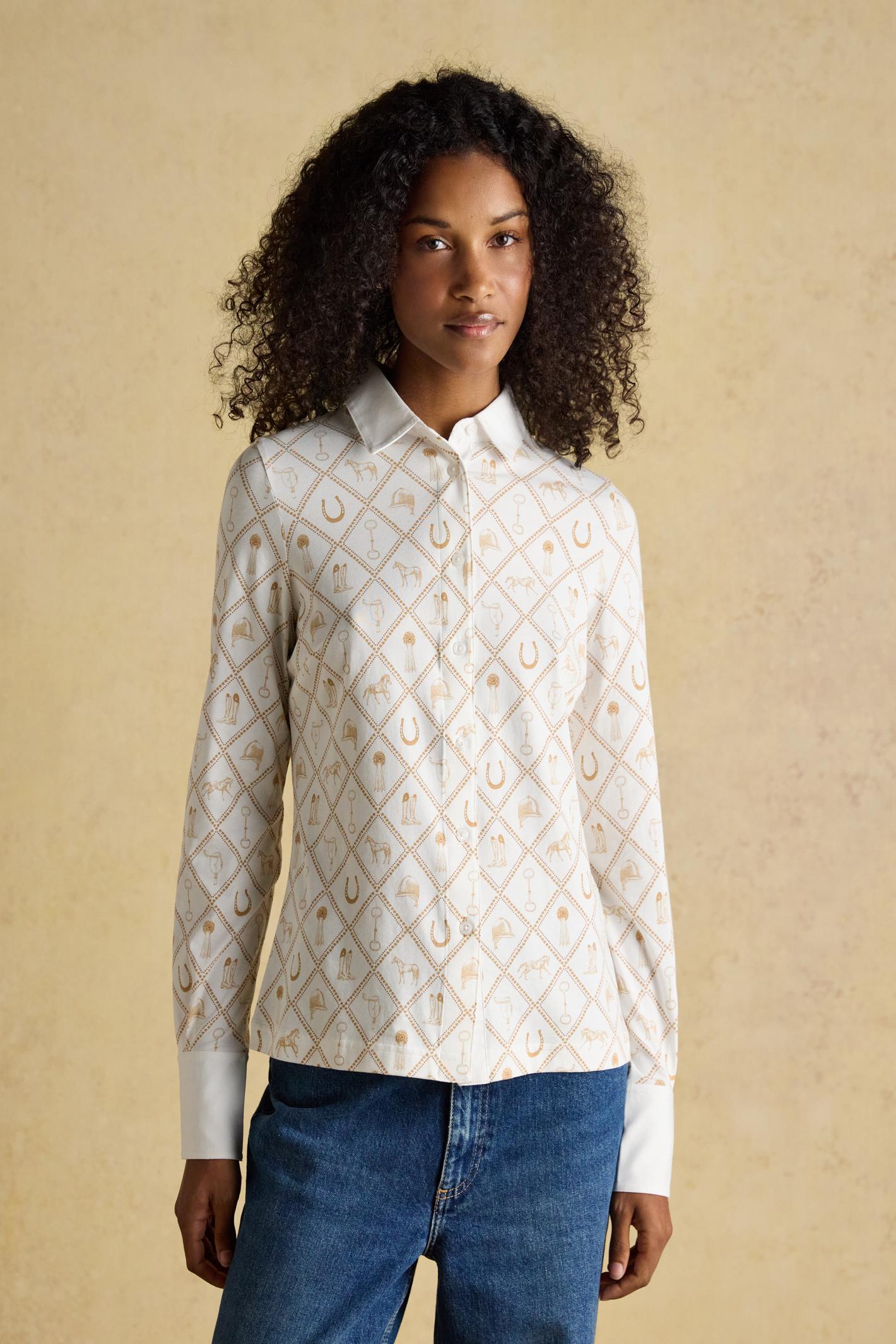 Designed with a classic collar, button-through front and long sleeves with cuffs, it sits neatly without feeling restrictive. Shop Joules at Dotique.