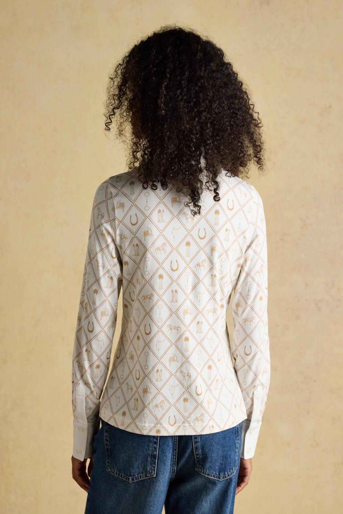 Designed with a classic collar, button-through front and long sleeves with cuffs, it sits neatly without feeling restrictive. Shop Joules at Dotique.