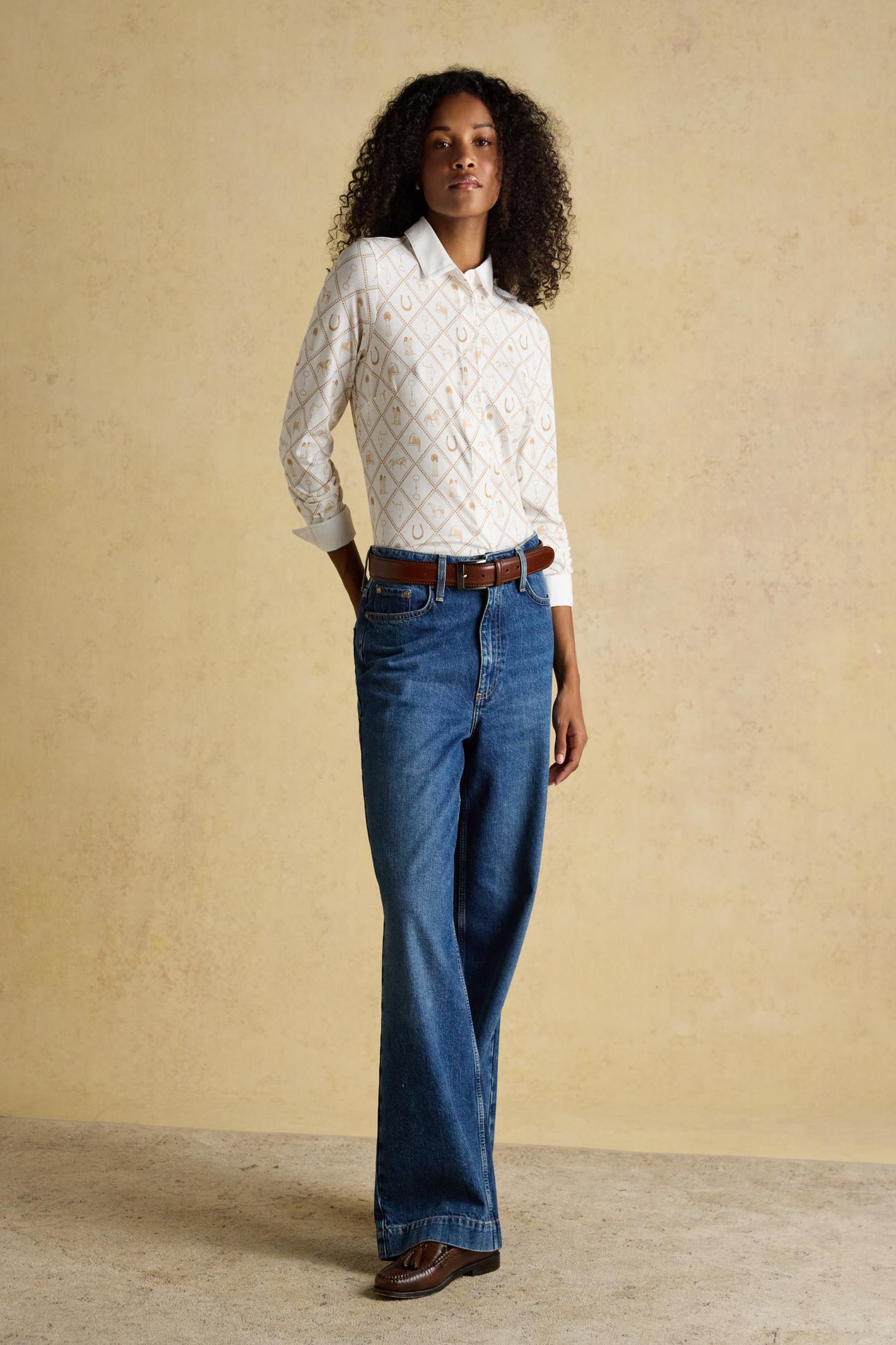 Designed with a classic collar, button-through front and long sleeves with cuffs, it sits neatly without feeling restrictive. Shop Joules at Dotique.