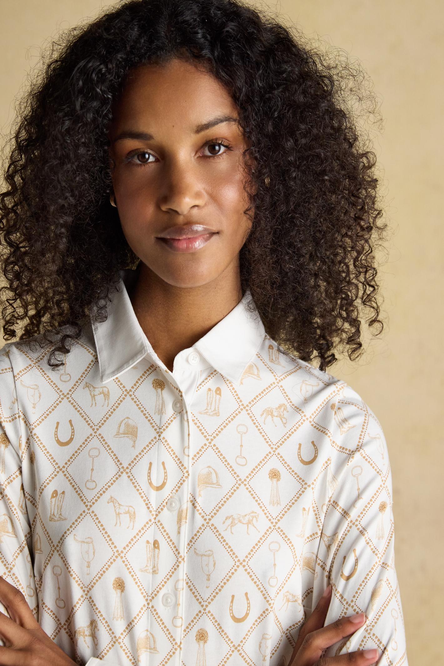 Designed with a classic collar, button-through front and long sleeves with cuffs, it sits neatly without feeling restrictive. Shop Joules at Dotique.