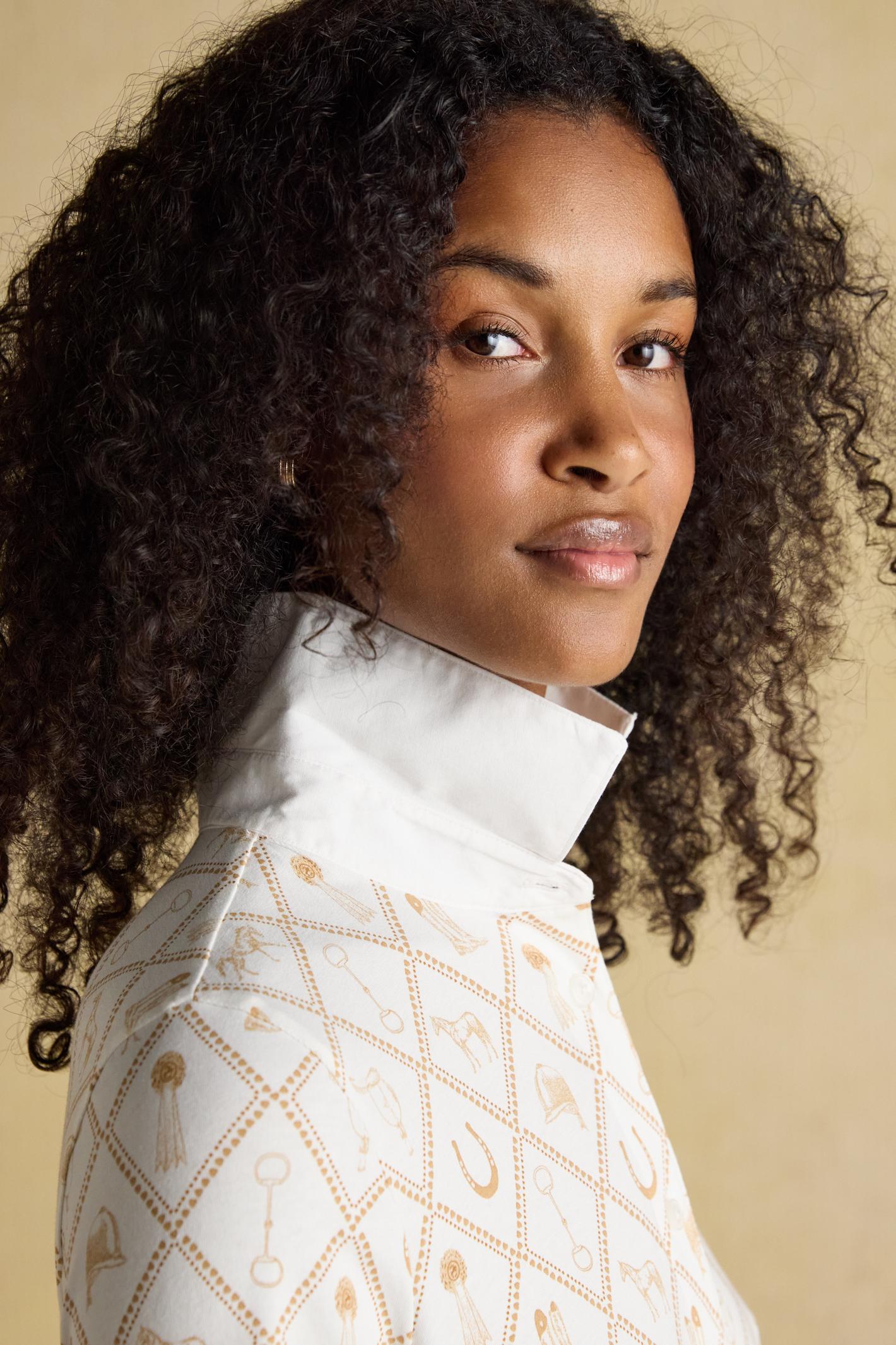 Designed with a classic collar, button-through front and long sleeves with cuffs, it sits neatly without feeling restrictive. Shop Joules at Dotique.