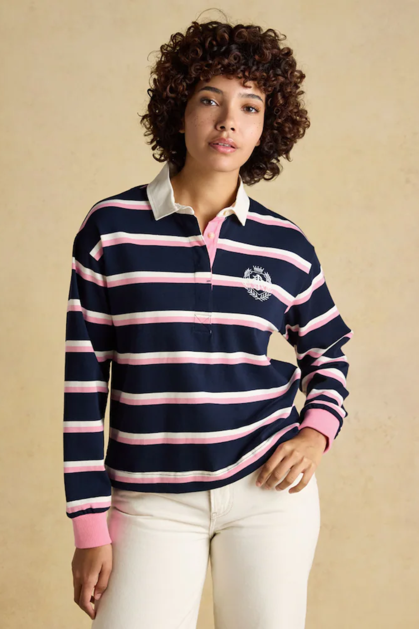 Model wearing Joules W30854 Lara Rugby Shirt – Navy / Pink Stripe by Joules, shop Joules at Dotique.