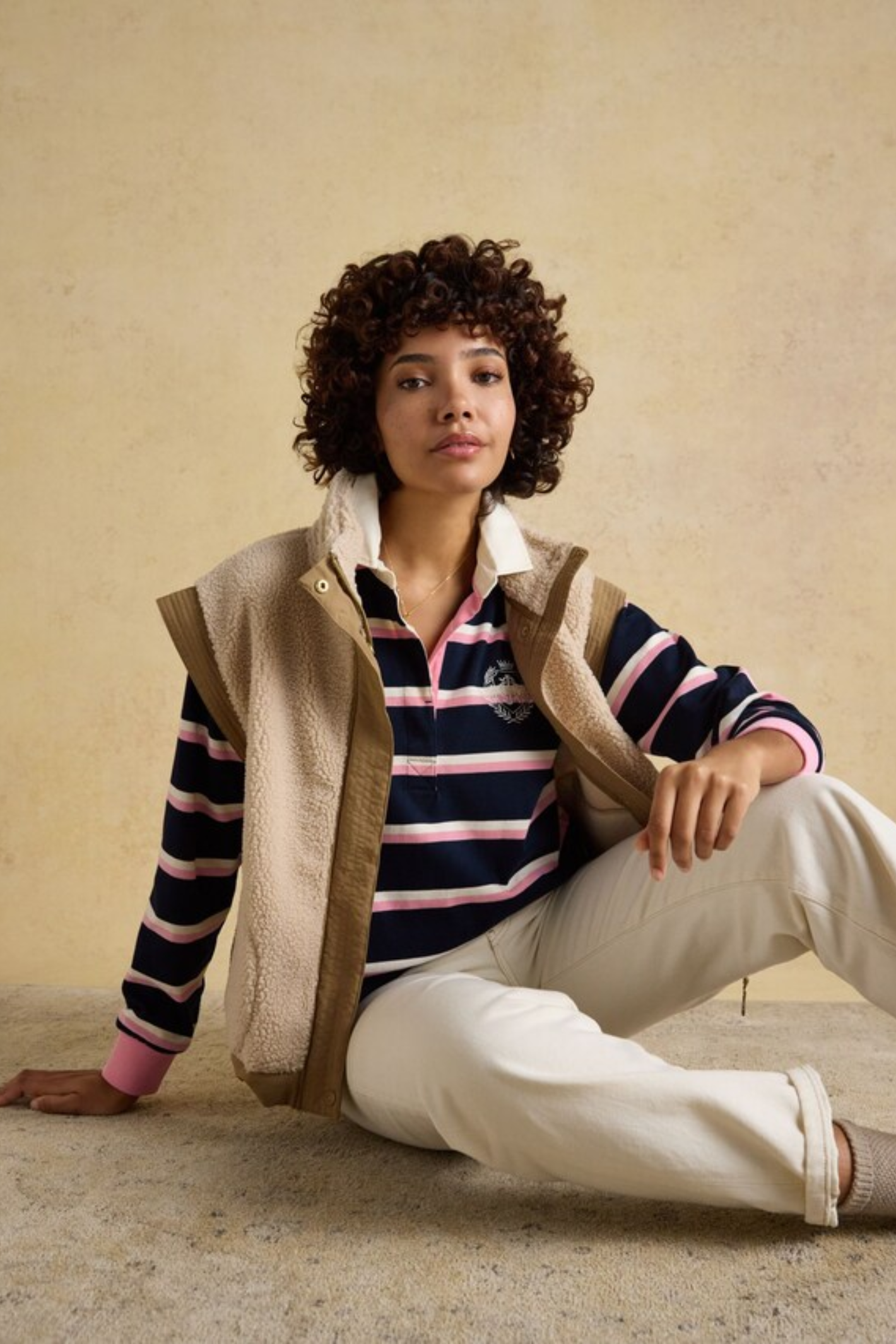 Model wearing Joules W30854 Lara Rugby Shirt – Navy / Pink Stripe by Joules, shop Joules now at Dotique.