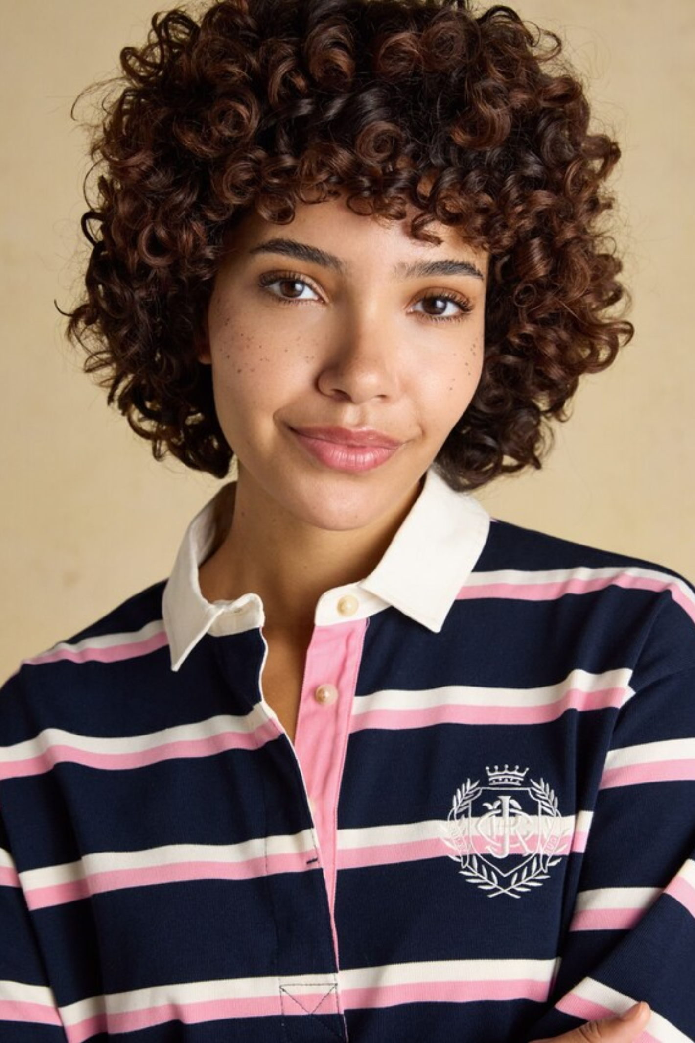 Model wearing Joules W30854 Lara Rugby Shirt – Navy / Pink Stripe by Joules, shop the Joules collection at Dotique.