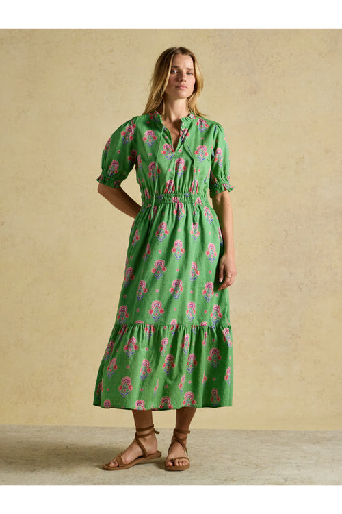 Model wearing Joules W70263 Larissa Green Pink Midi Dress with gathered waist and puff sleeves by Joules. Shop Joules at Dotique.