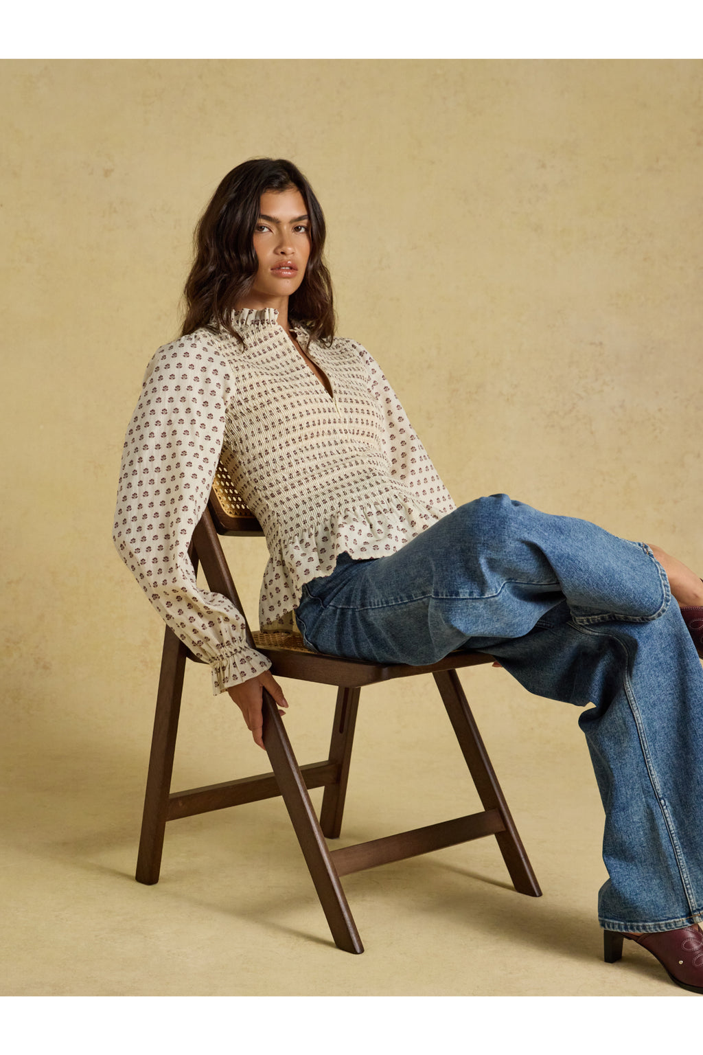 Shop the Joules Zoe Blouse in Cream Ditsy at Dotique. A 100% cotton blouse with a smocked bodice, frill collar, adjustable zip and long sleeves.