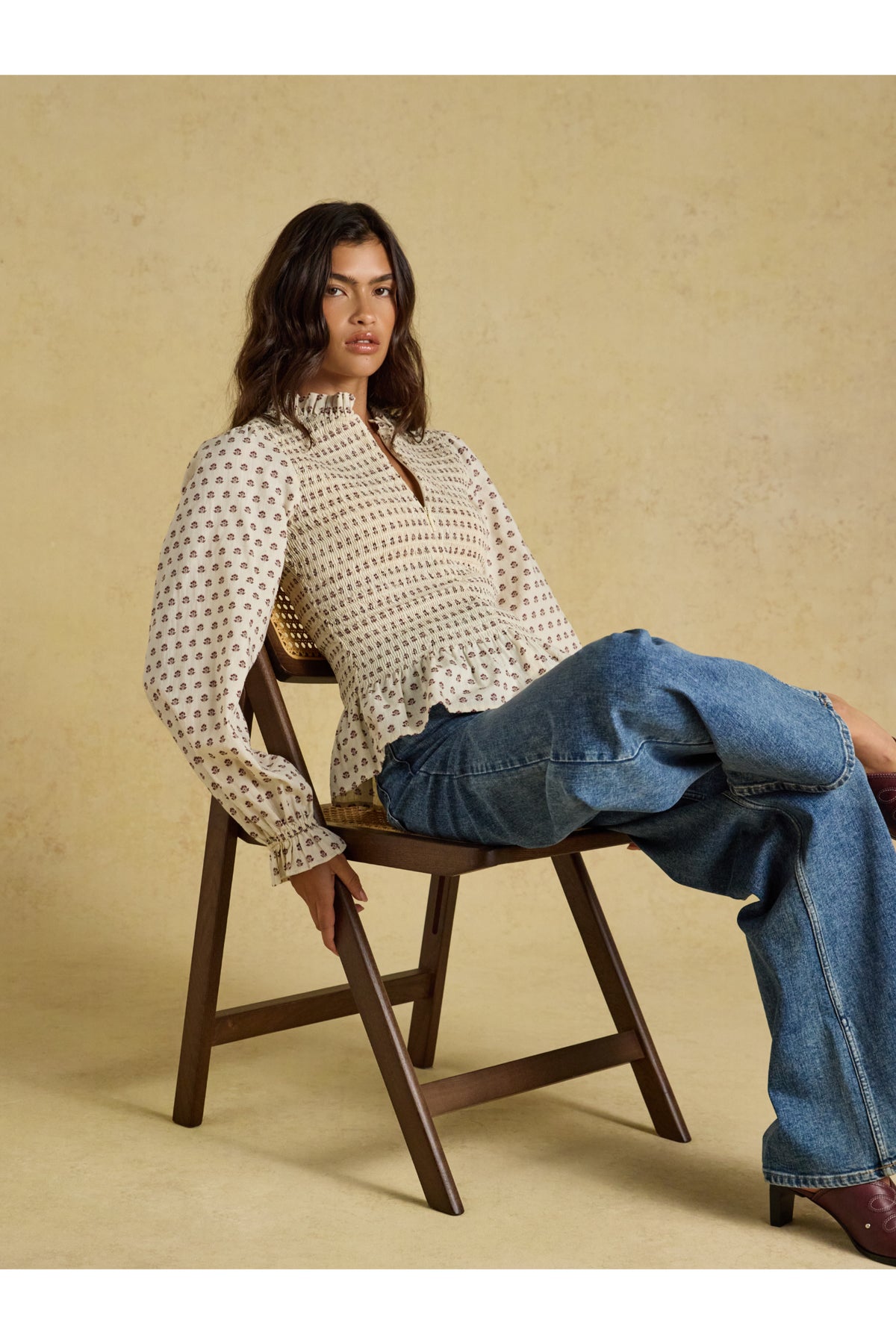 Shop the Joules Zoe Blouse in Cream Ditsy at Dotique. A 100% cotton blouse with a smocked bodice, frill collar, adjustable zip and long sleeves.