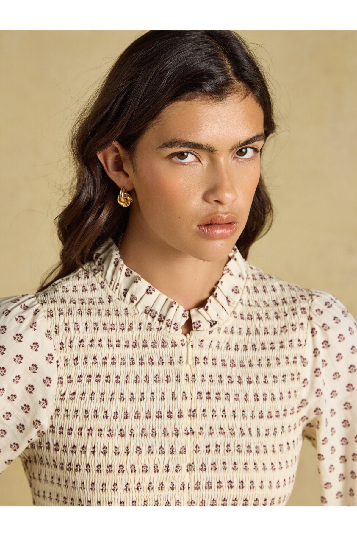 Shop the Joules Zoe Blouse in Cream Ditsy at Dotique. A 100% cotton blouse with a smocked bodice, frill collar, adjustable zip and long sleeves.