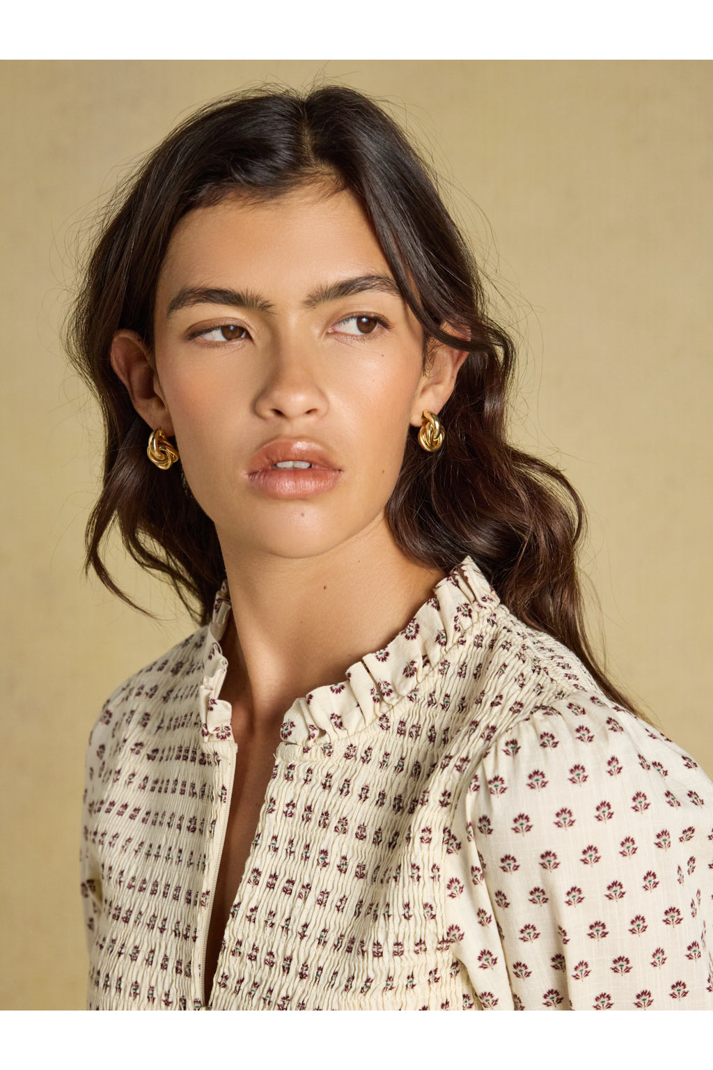 Shop the Joules Zoe Blouse in Cream Ditsy at Dotique. A 100% cotton blouse with a smocked bodice, frill collar, adjustable zip and long sleeves.