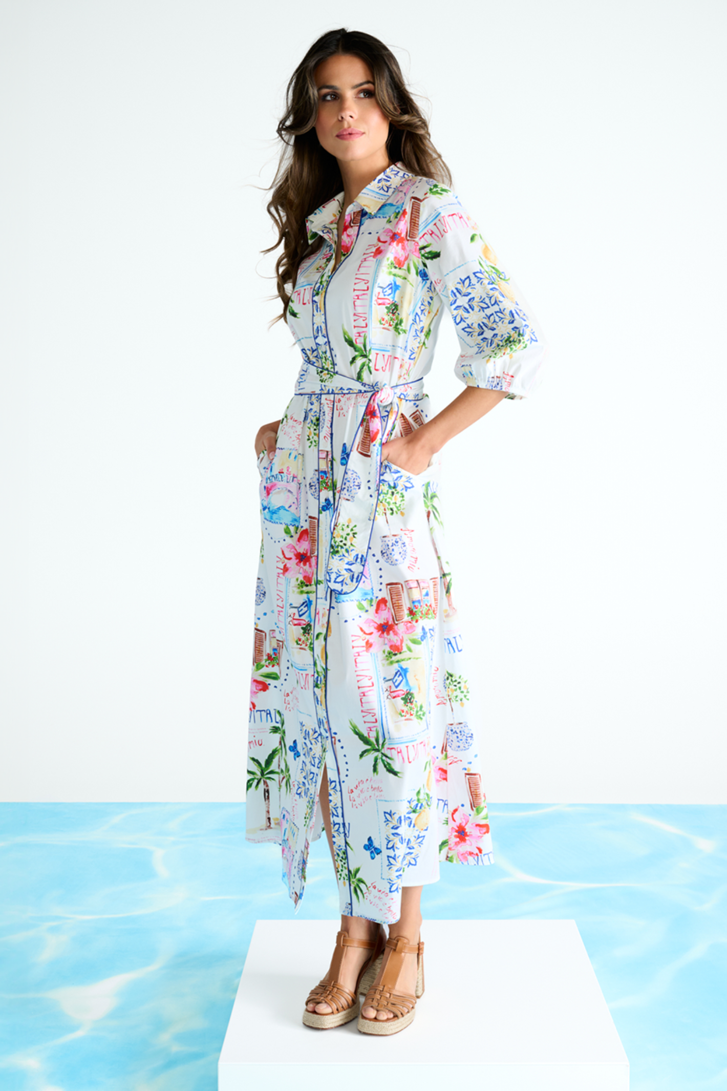 Woman wearing a floral dress on a white background