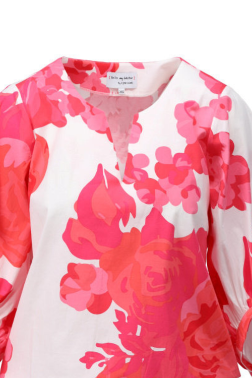 Floral blouse with pink and orange flowers on a white background
