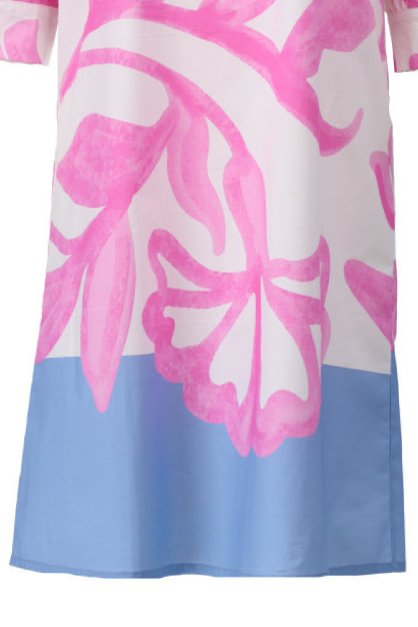 Close-up of midi dress hem with bold pink abstract floral design and solid light blue border detail