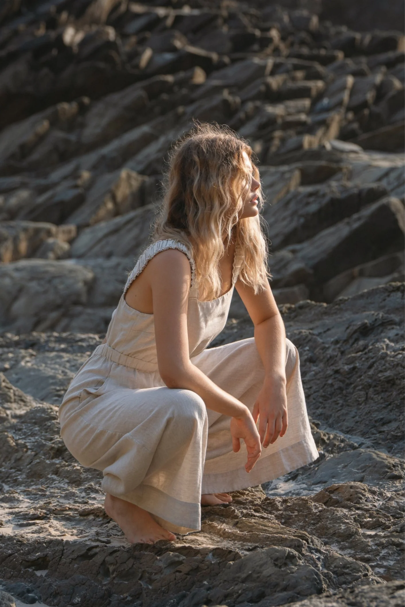 Woman wearing Lilly Pilly LPS23-D004 Keely Linen Jumpsuit Oatmeal by Lilly Pilly, shop Lilly Pilly at Dotique.