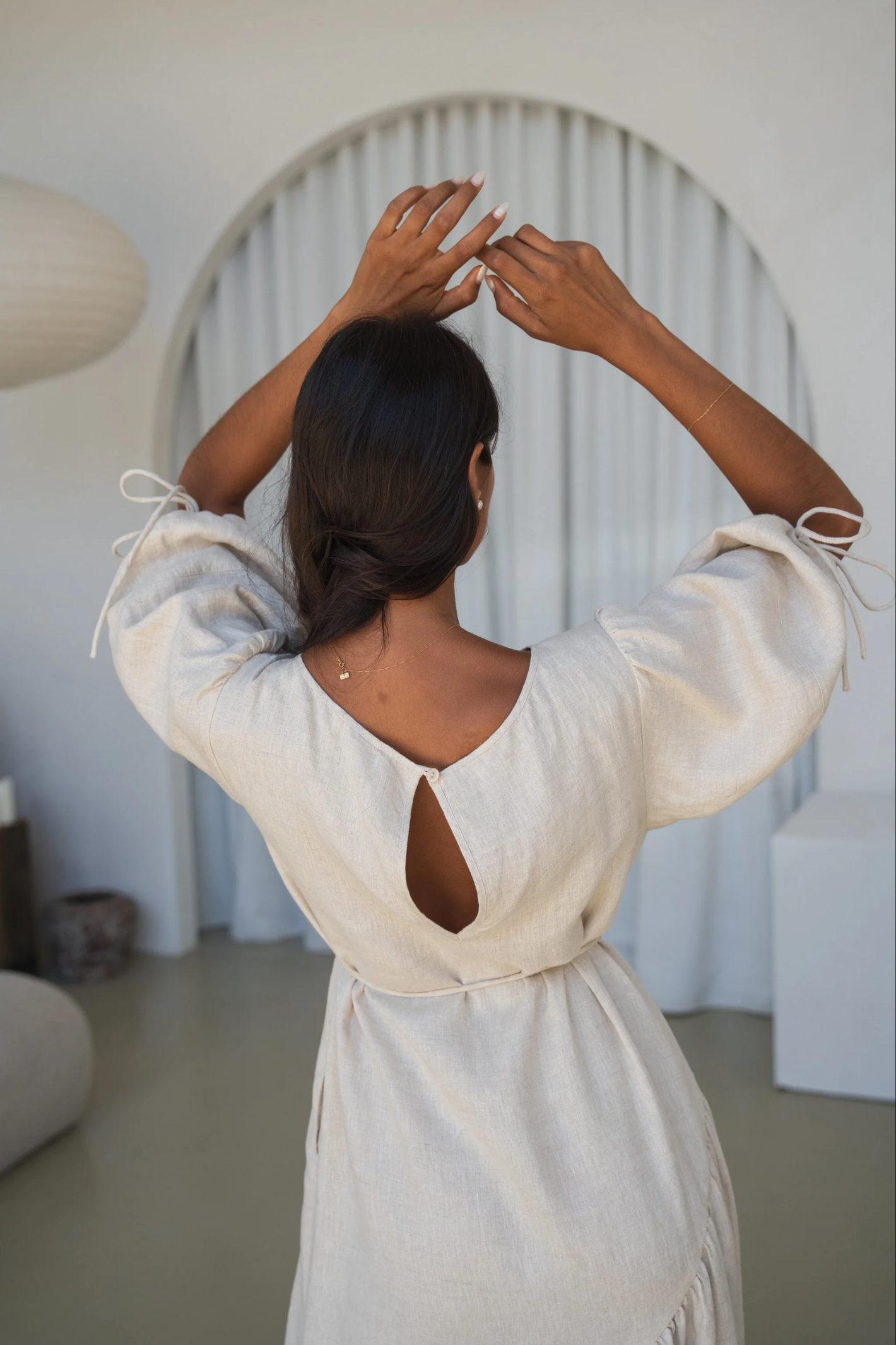 Woman wearing Lilly Pilly LPSS22-D002 Charlotte Linen Dress Oatmeal by Lilly Pilly Shop Lilly Pilly at Dotique