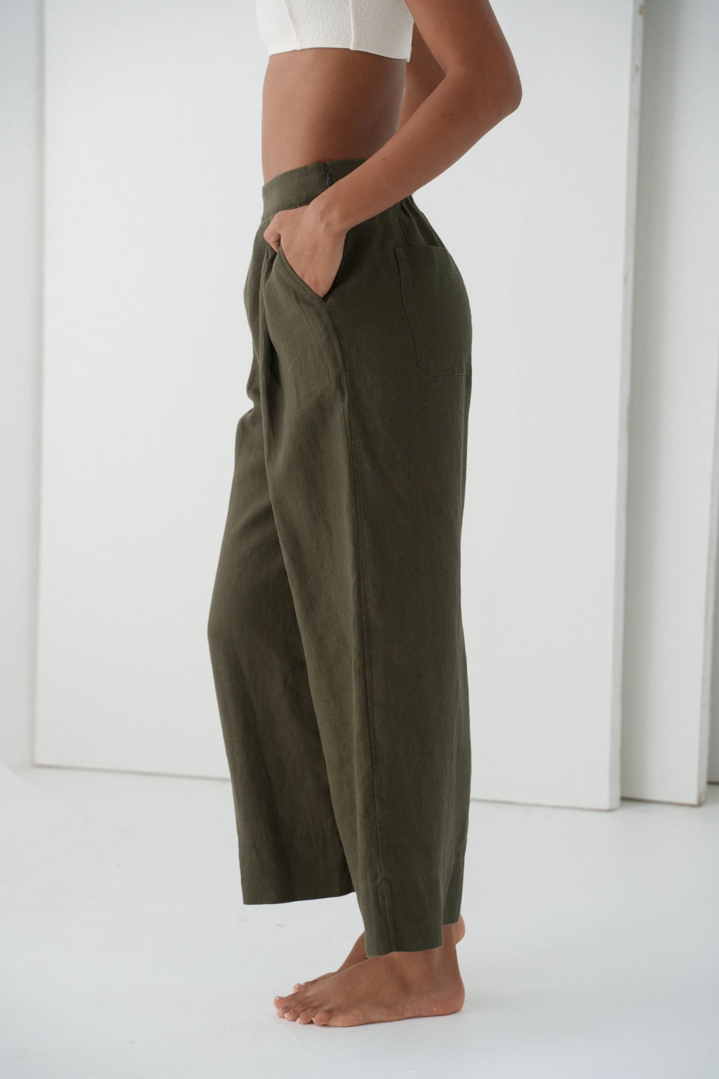 Model wearing Lilly Pilly LPW23-P002 Ivy Linen Crop Trousers Khaki by Lilly Pilly, shop the brand at Dotique.