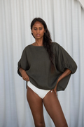 Model wearing Lilly Pilly LPW23-T001 Tina Linen Top Khaki by Lilly Pilly, shop Lilly Pilly at Dotique for stylish linen tops.
