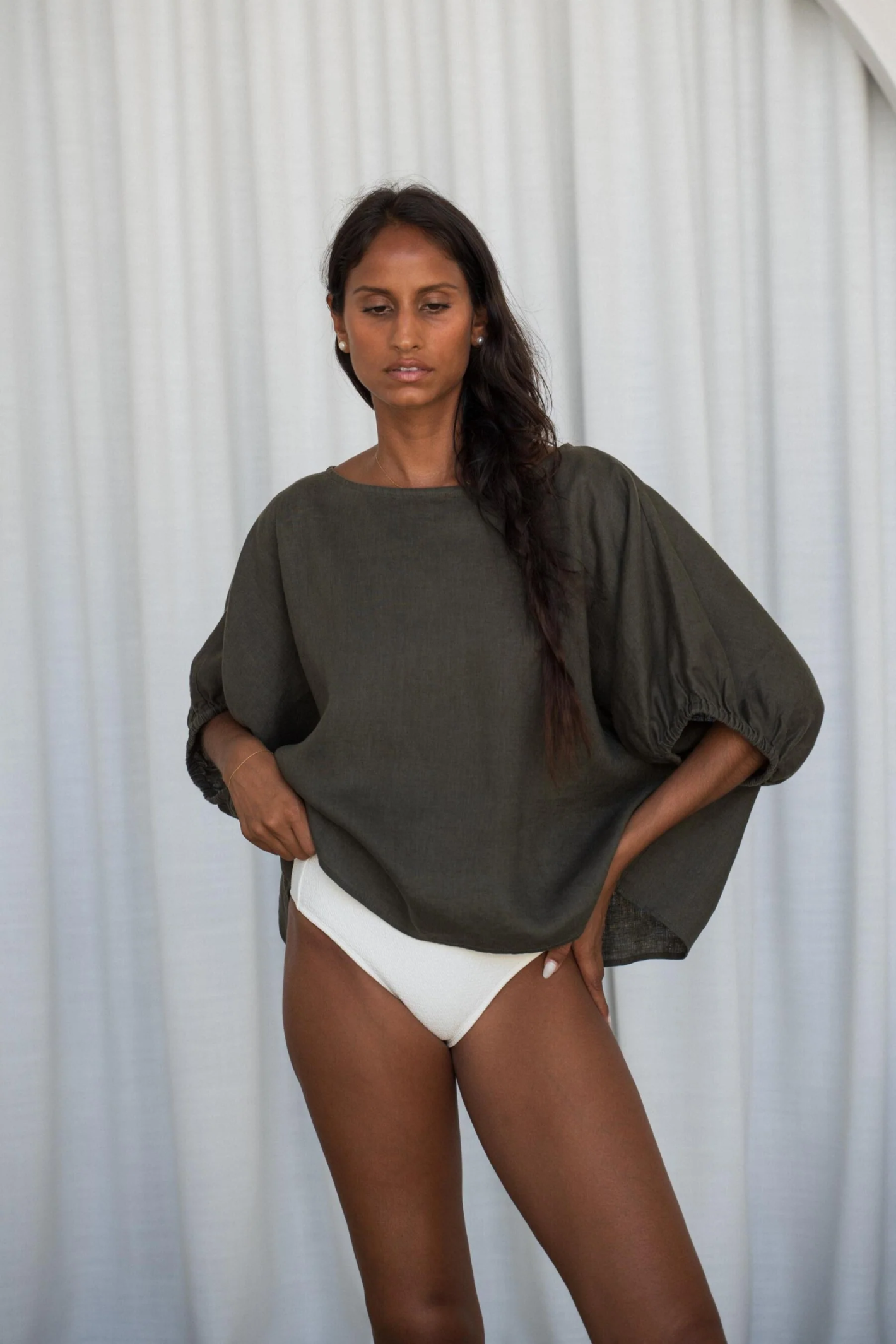 Model wearing Lilly Pilly LPW23-T001 Tina Linen Top Khaki by Lilly Pilly, shop Lilly Pilly at Dotique for stylish linen tops.