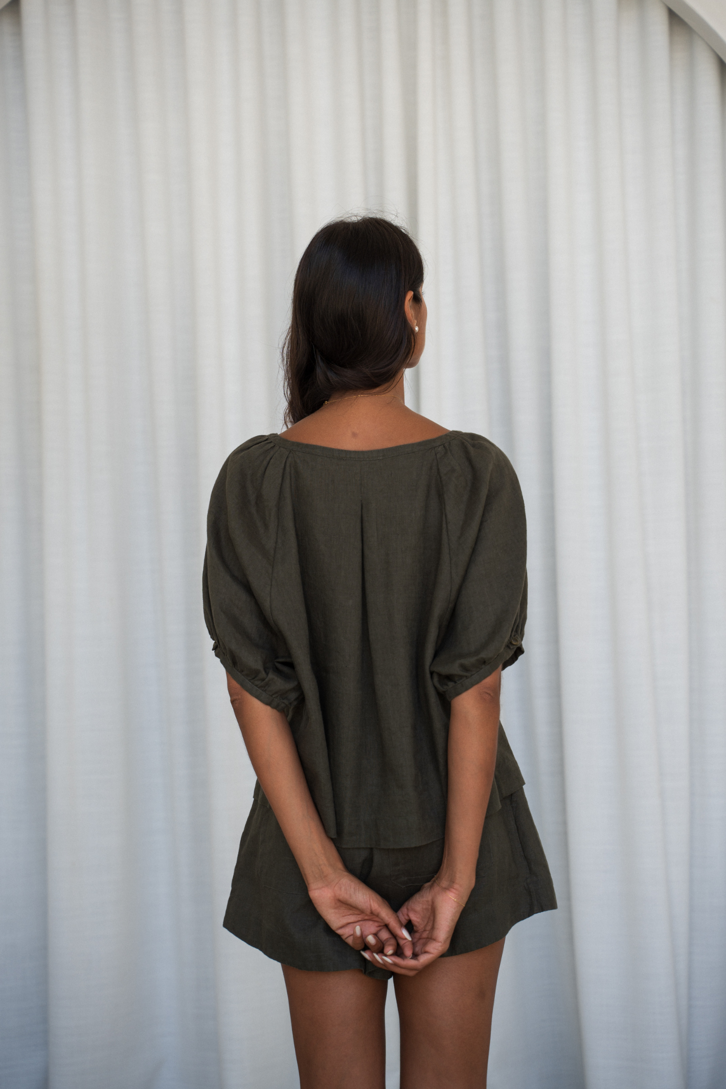 Back view of woman wearing Lilly Pilly LP-T008 Pia Linen Top Khaki by Lilly Pilly, shop Lilly Pilly at Dotique