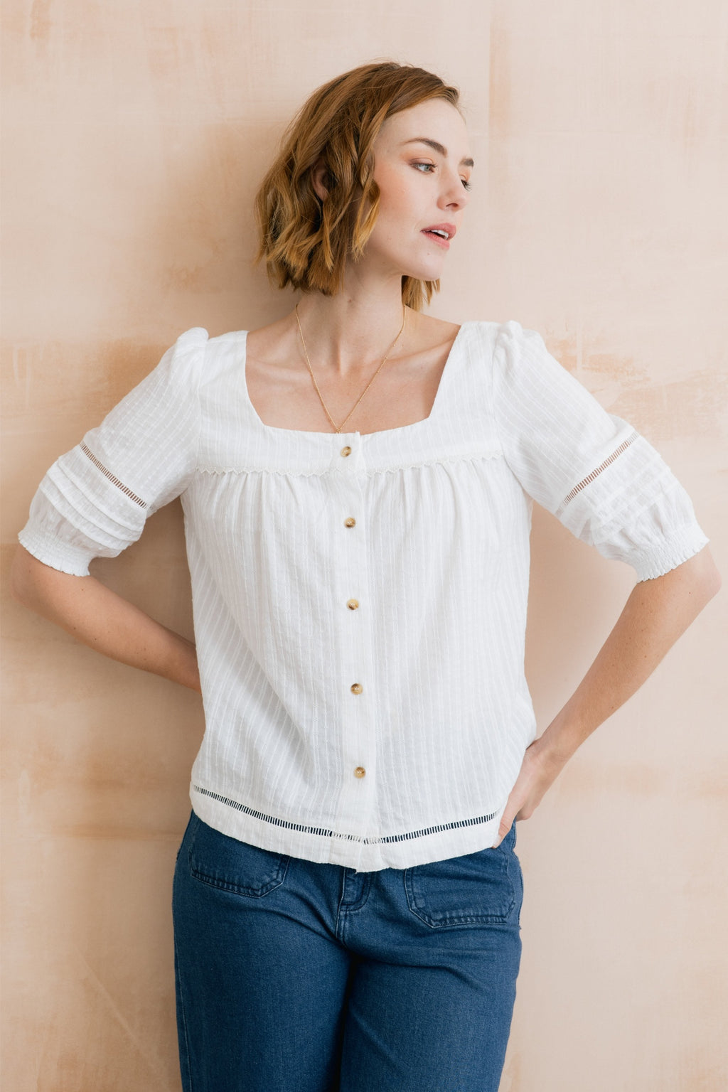 Lily & Me LM26137 Poppy Blouse Plain Stripe Dobby White worn by model, featuring a square neckline and button front by Lily & me. Shop Lily & me at Dotique.