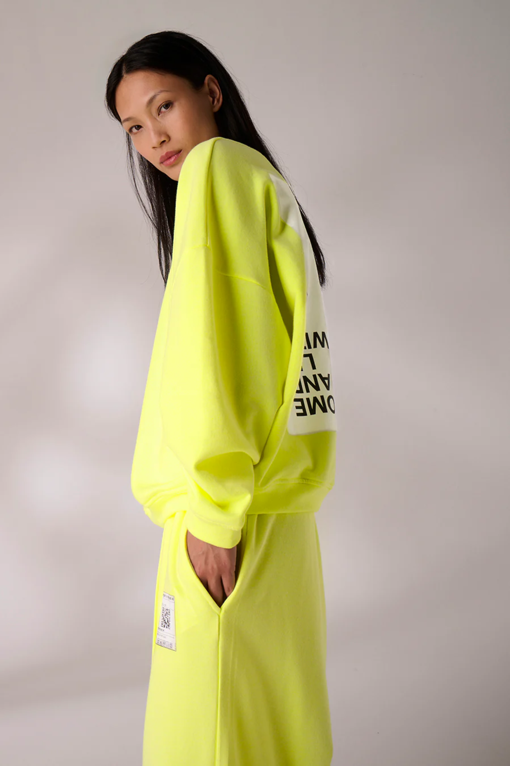 Side view of model wearing Liv Bergen Ella Sweater Come in Neon Yellow by liv bergen Shop liv bergen at Dotique