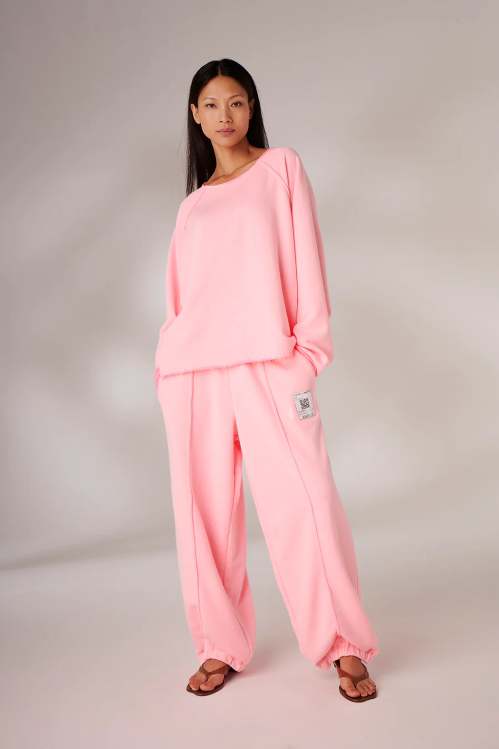 Model wearing Liv Bergen Fine Sweater Tag in Neon Pink by liv bergen shop liv bergen at Dotique full body view