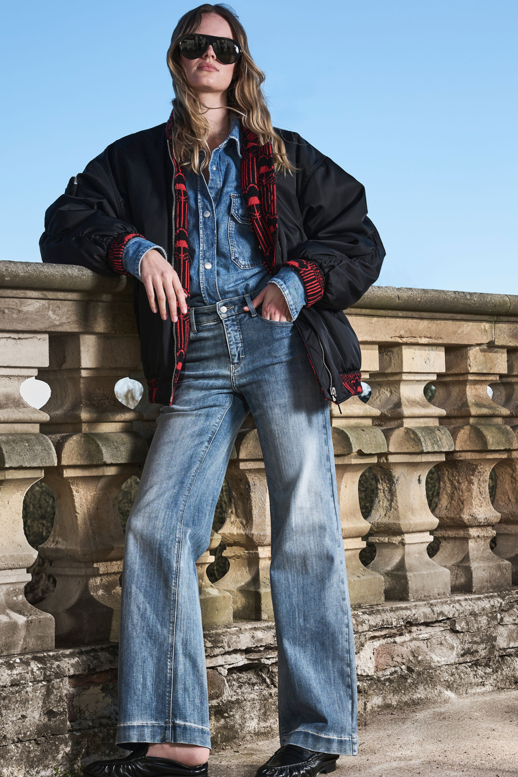 Model wearing MAC Dream Wide Authentic Sky Blue Wash wide leg stretch jeans in a light blue denim wash.