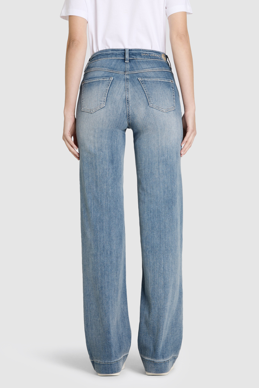 Model wearing MAC Dream Wide Authentic Sky Blue Wash wide leg stretch jeans in a light blue denim wash. Shop MAC Jeans at Dotique.