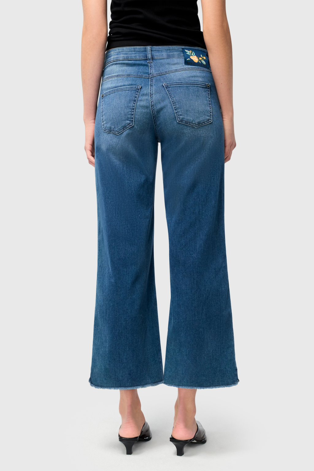 Designed for effortless style and comfort, the Dotique MAC Dream Wide Cropped Jeans in Storm Blue Wash offer a modern, relaxed silhouette. Shop MAC Jeans at Dotique.