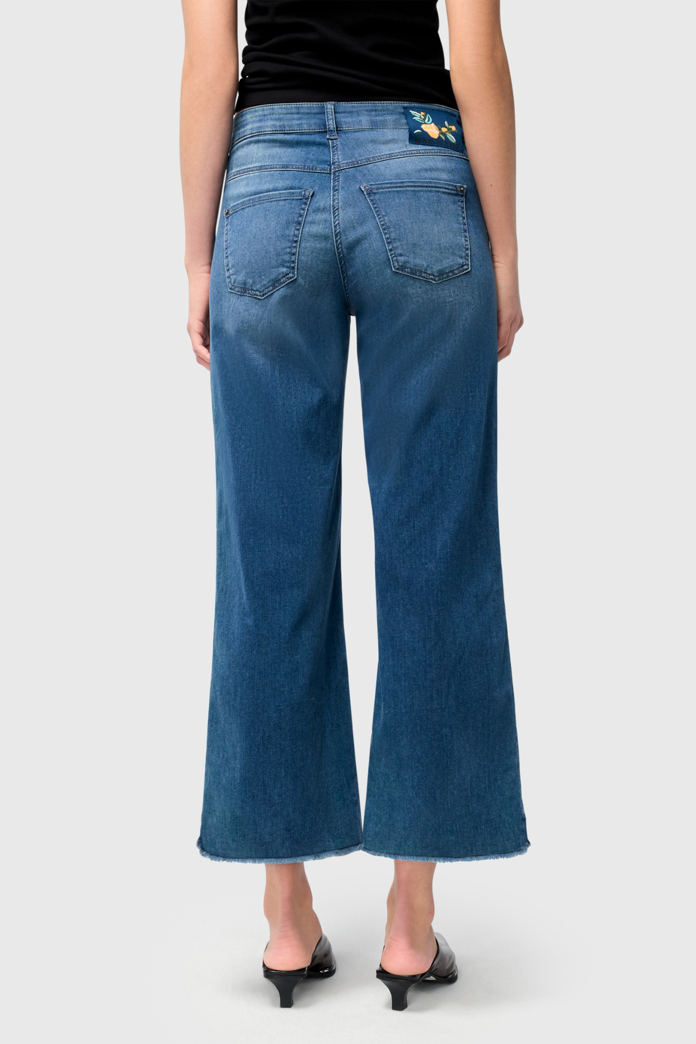 Designed for effortless style and comfort, the Dotique MAC Dream Wide Cropped Jeans in Storm Blue Wash offer a modern, relaxed silhouette. Shop MAC Jeans at Dotique.