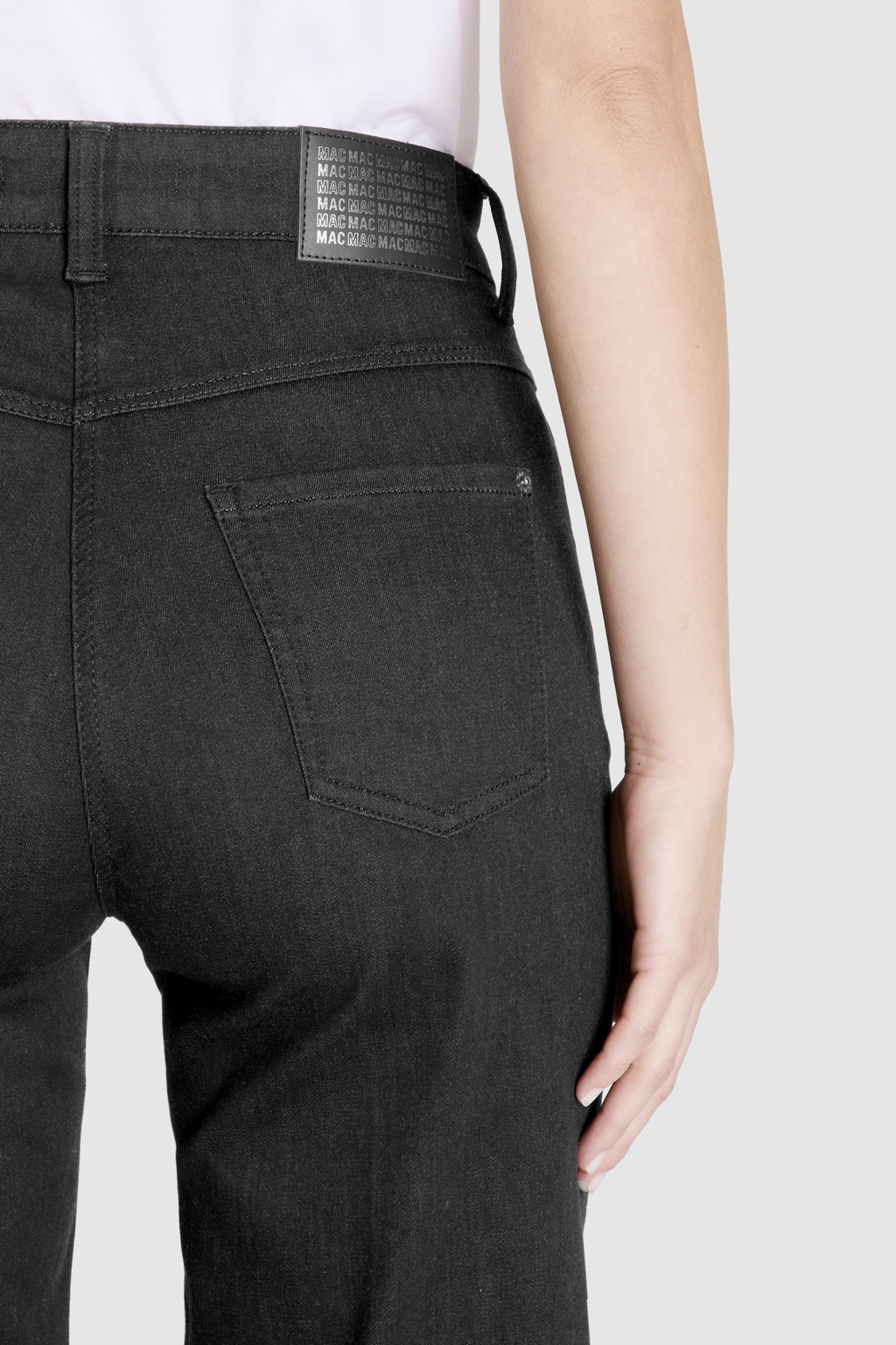 Close-up of back pocket and logo patch on MAC Jeans 5228-90-0387L D999 Black Wide Authentic Stretch Denim Jeans by Mac Jeans, shop Mac Jeans at Dotique