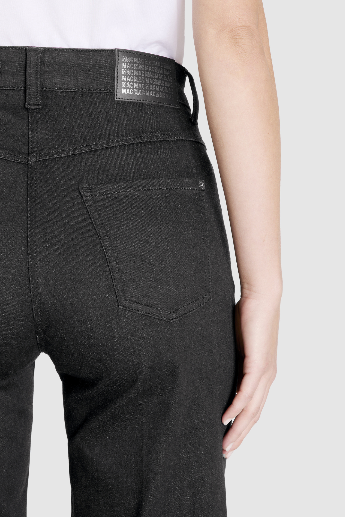 Close-up of back pocket and logo patch on MAC Jeans 5228-90-0387L D999 Black Wide Authentic Stretch Denim Jeans by Mac Jeans, shop Mac Jeans at Dotique