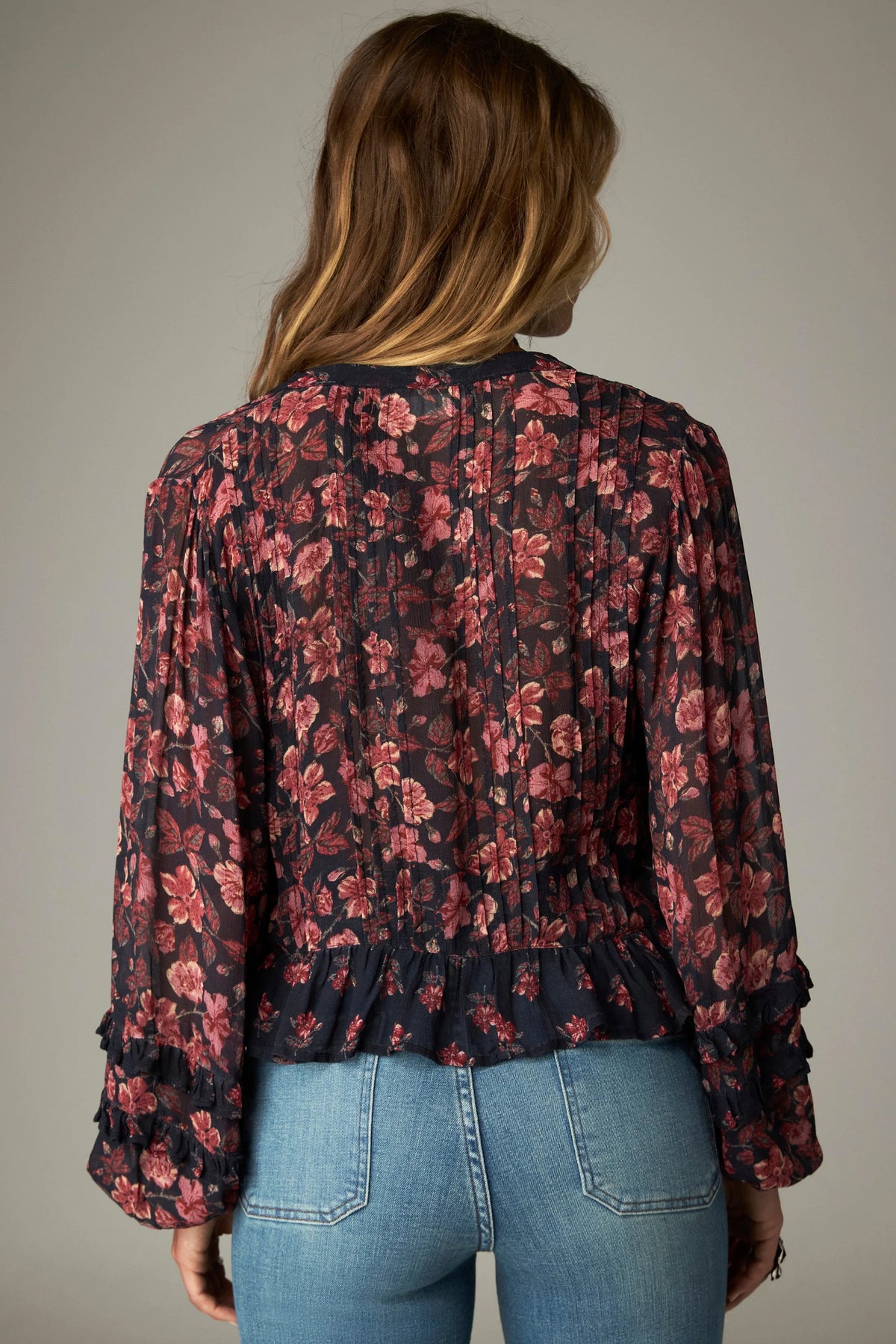 Shop the Maison Hotel Lerele Blouse in Punk Pink at Dotique. A printed cropped blouse with a pleated front, band collar and ruffled hem.