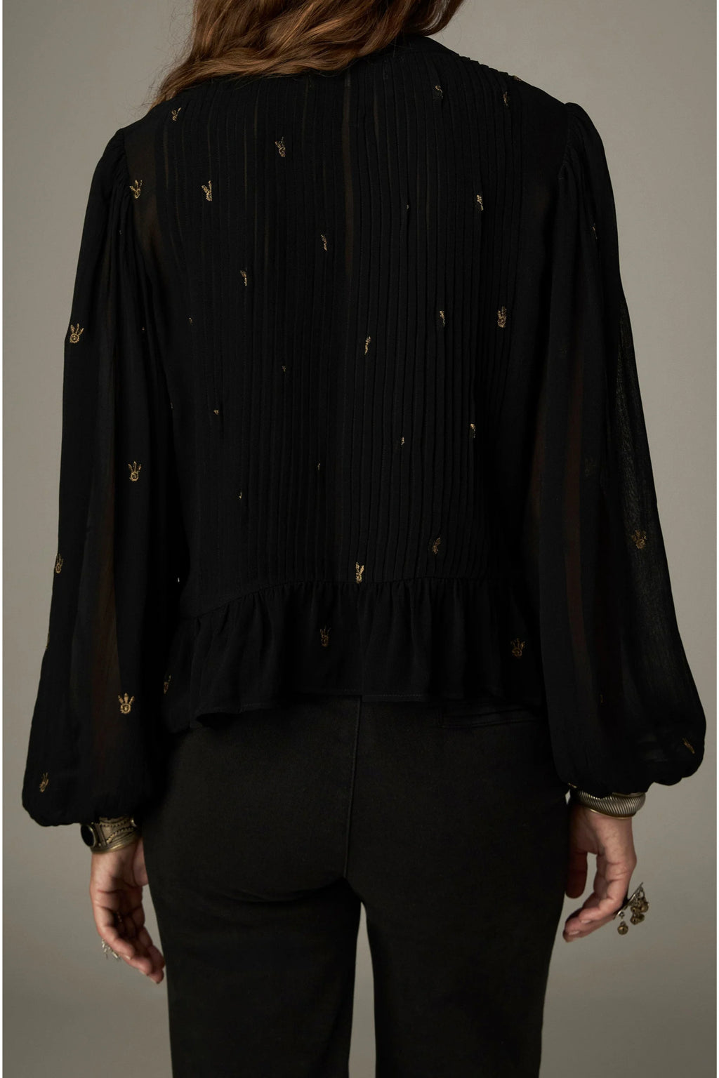 Shop the Maison Hotel Catherine Blouse in Blackout at Dotique. An embroidered black blouse with a cropped shape, ruffled hem and mother-of-pearl buttons.