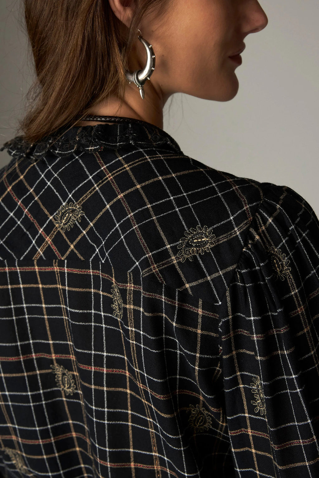 Shop the Maison Hotel Coco Blouse in Noir Plaid at Dotique. A checked cotton blouse with subtle lurex, embroidery and pretty ruffle detailing.
