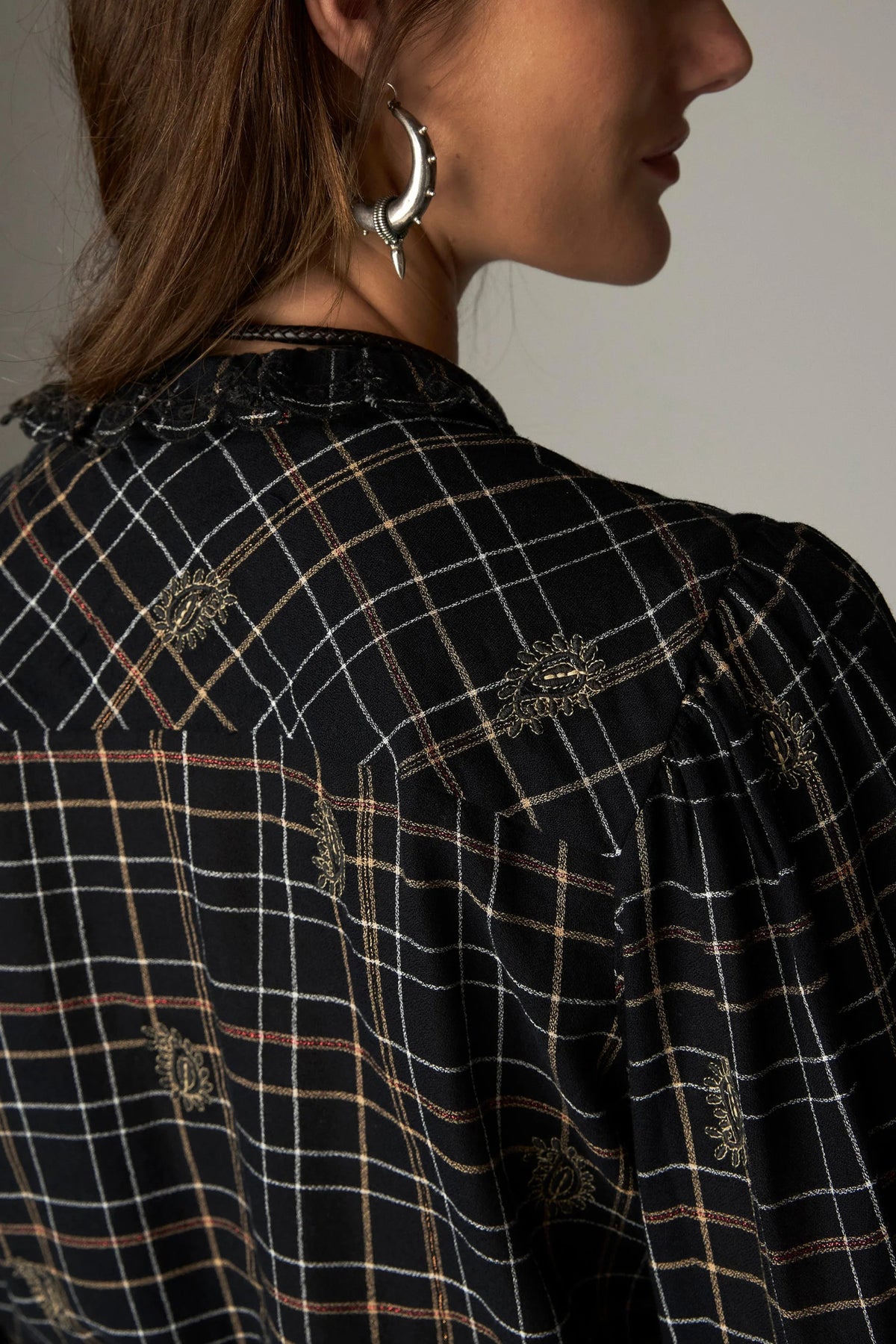 Shop the Maison Hotel Coco Blouse in Noir Plaid at Dotique. A checked cotton blouse with subtle lurex, embroidery and pretty ruffle detailing.