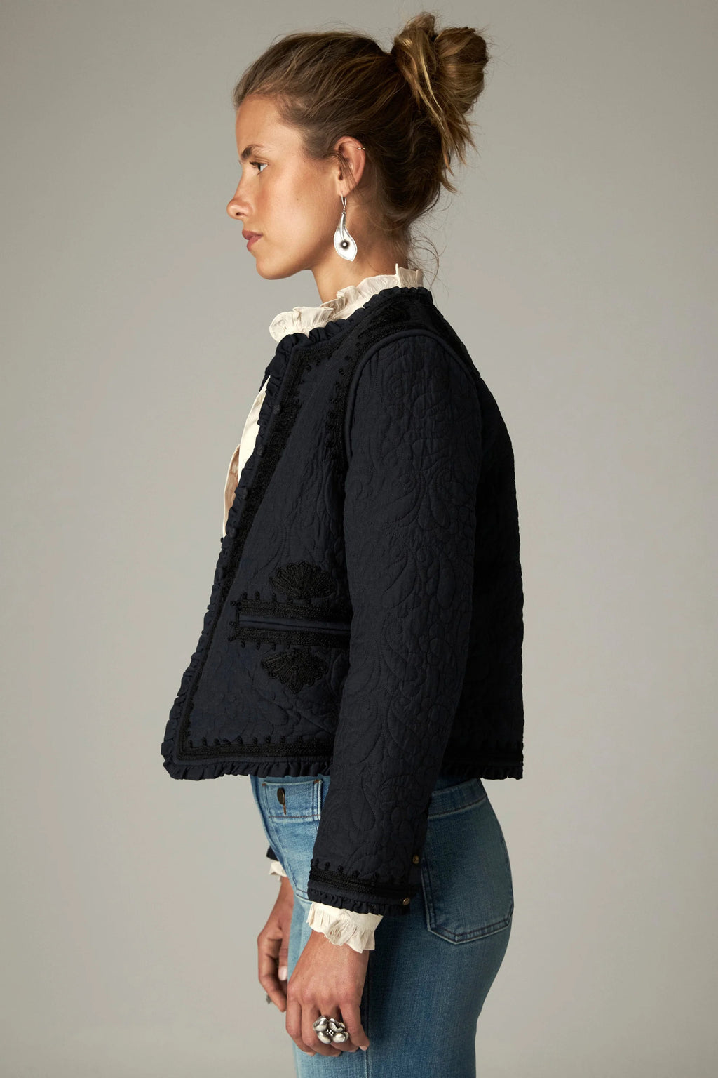Shop the Maison Hotel Paco Jacket in Ceniza at Dotique. A cropped collarless jacket with embroidered trims, an open front and patch pockets.