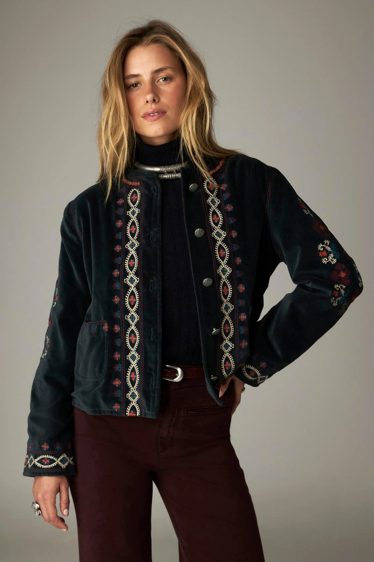 Shop the Maison Hotel Breton Jacket in Jade at Dotique. A cotton velvet jacket with colourful embroidered trims, button front and patch pockets.