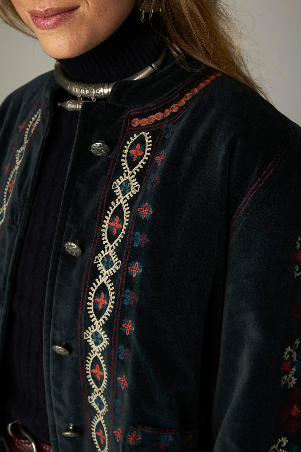 Shop the Maison Hotel Breton Jacket in Jade at Dotique. A cotton velvet jacket with colourful embroidered trims, button front and patch pockets.