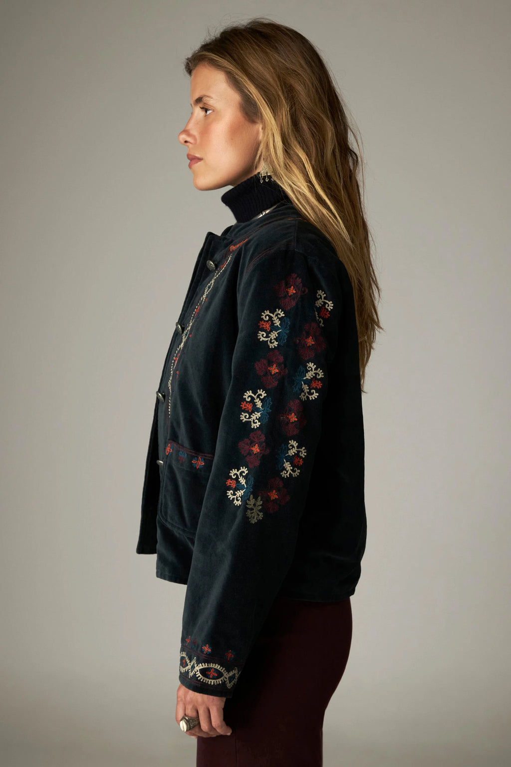 Shop the Maison Hotel Breton Jacket in Jade at Dotique. A cotton velvet jacket with colourful embroidered trims, button front and patch pockets.